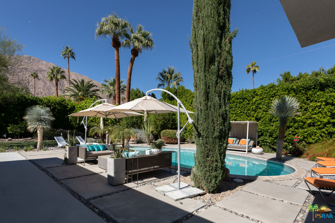 646 East Morongo Road Palm Springs, CA 92264 - Photo 33 of 45 a view of a patio with table and chairs potted plants