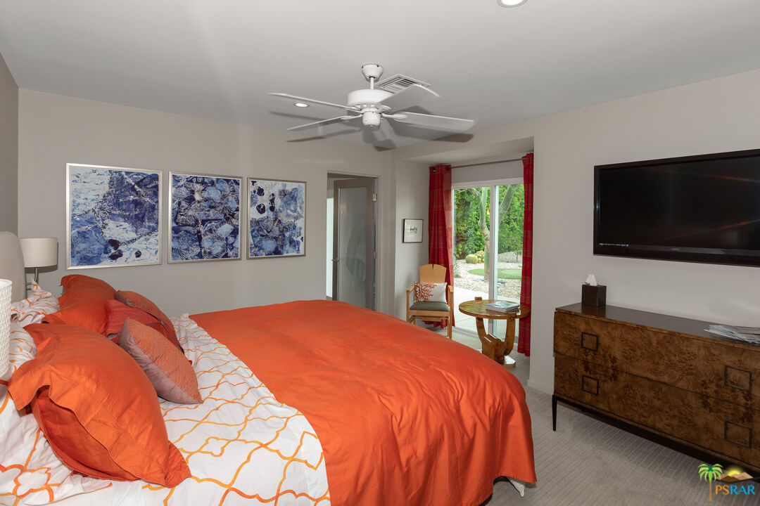 646 East Morongo Road Palm Springs, CA 92264 - Photo 36 of 45 a bedroom with a bed and a flat screen tv