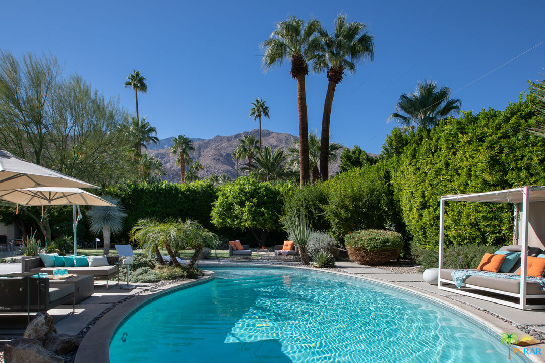 646 East Morongo Road Palm Springs, CA 92264 - Photo 41 of 45 a view of a backyard with couches under an umbrella