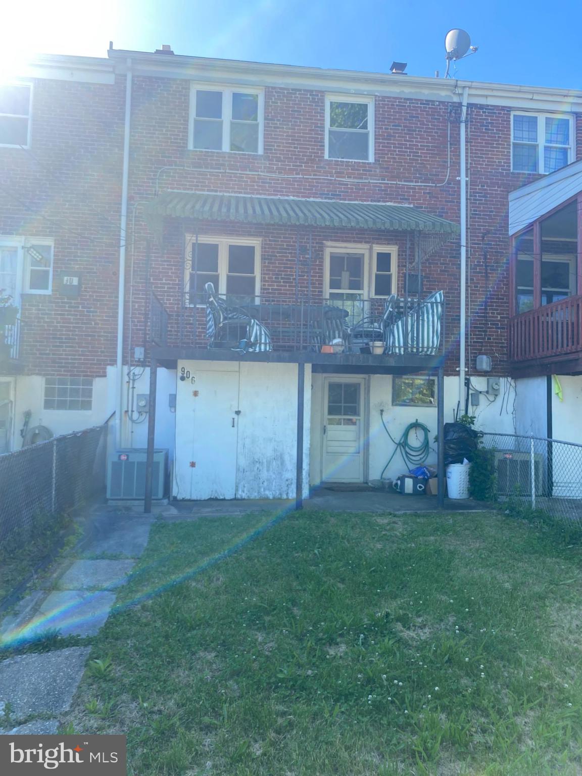 906 Masefield Road Baltimore, MD 21207 - Photo 20 of 22 a view of a brick house with a yard and a large window