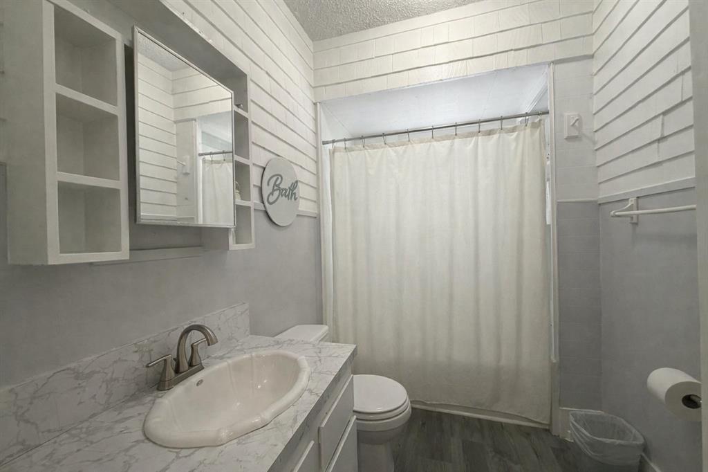 2912 10th Street Wichita Falls, TX 76309 - Photo 9 of 16 a bathroom with a sink and a toilet