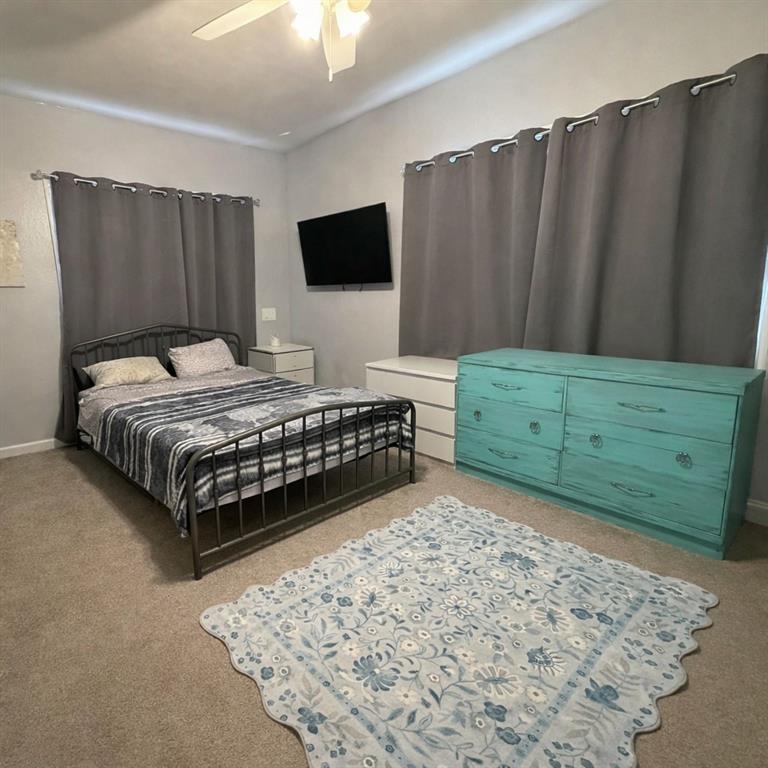 2912 10th Street Wichita Falls, TX 76309 - Photo 10 of 16 a bedroom with a bed and mirror