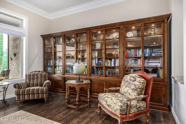a living room with furniture and a ceiling fan
