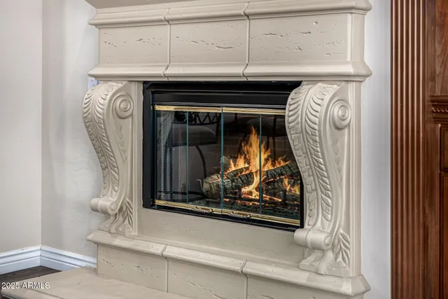 a reading room with furniture and a window