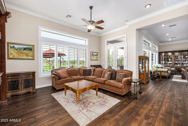 a kitchen with wooden cabinets and a wooden floor