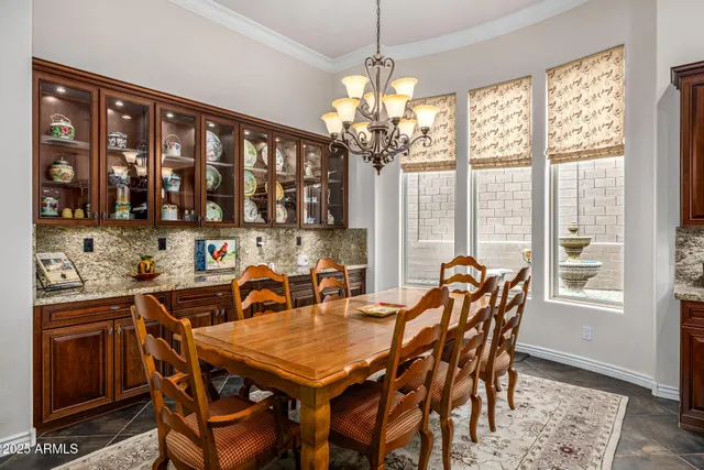 a room with lots of trees and entertaining space