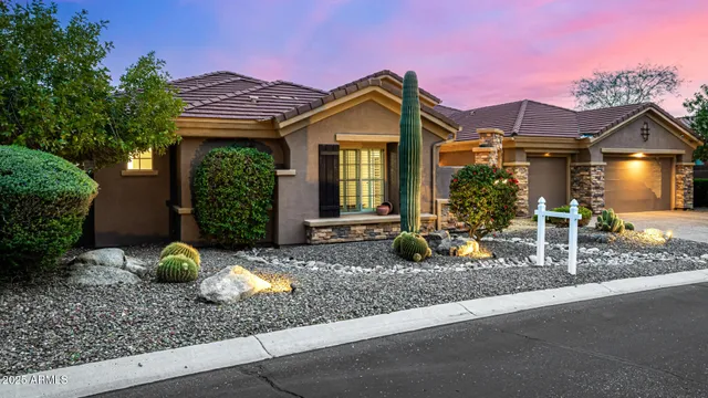 a kitchen with stainless steel appliances granite countertop a stove top oven a sink dishwasher a dining table and chairs