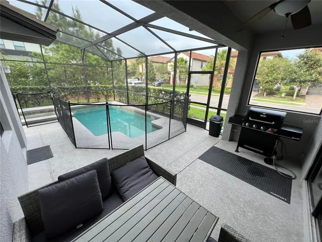 a room with wooden floor and furniture