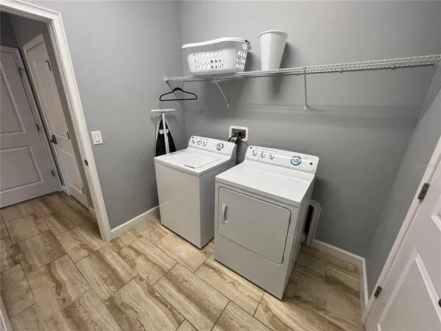 a utility room with dryer and washer
