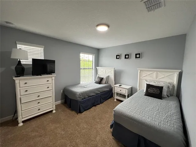 a room with a sink and furniture