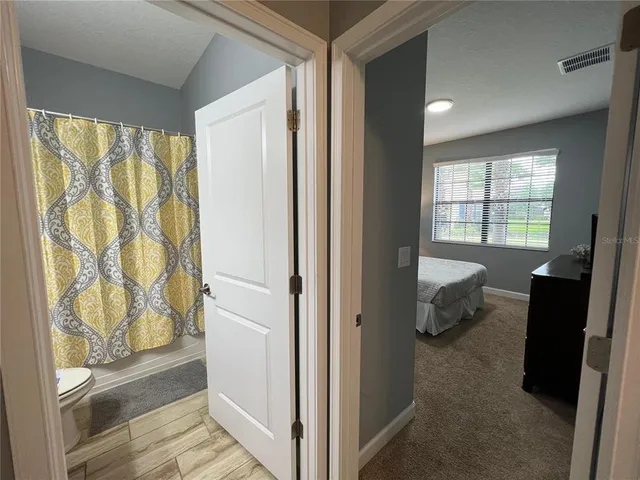 a view of a living room and hardwood floor