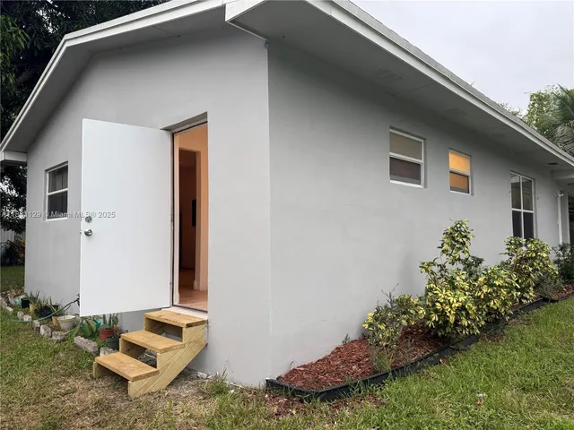 a backyard of a house with lots of green space