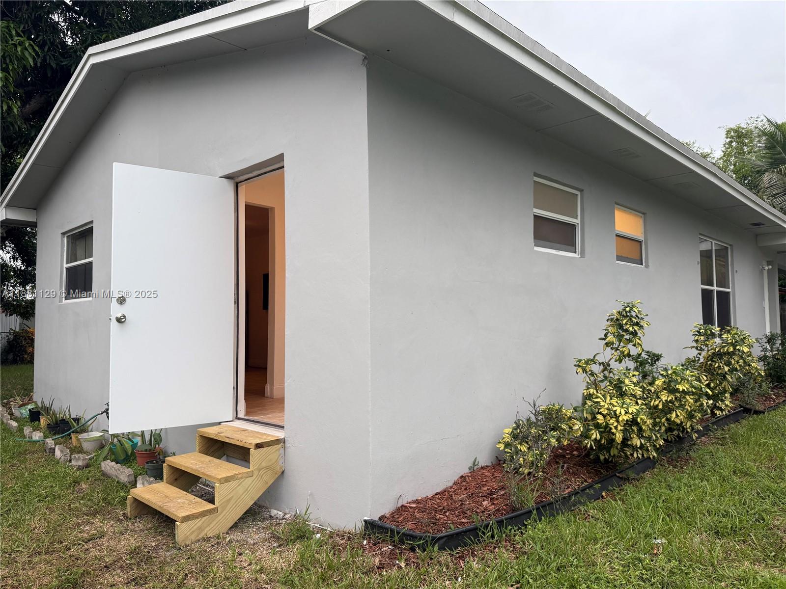 a backyard of a house with lots of green space