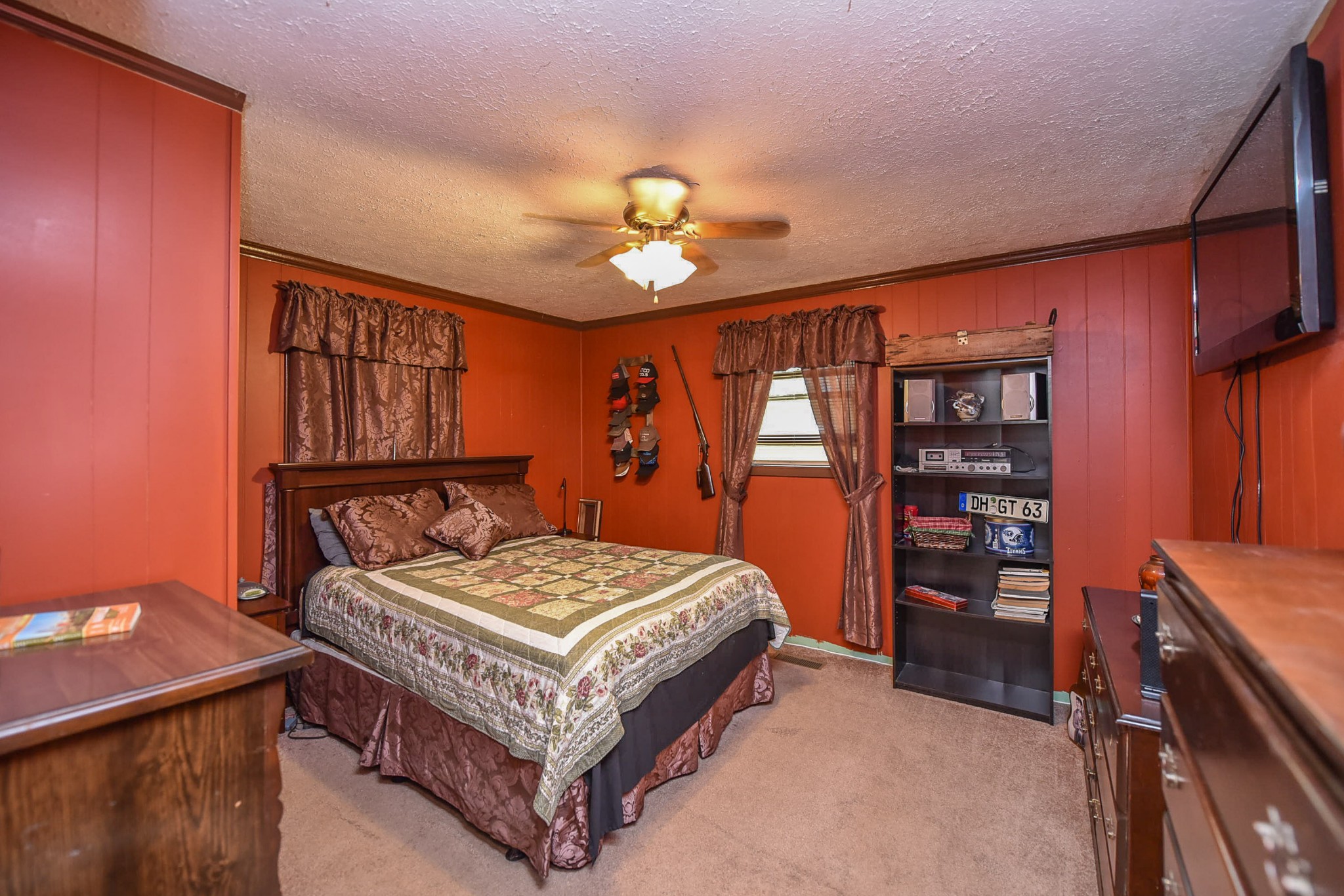 4601 Kinneys Road Springfield, TN 37172 - Photo 23 of 30 a bedroom with a bed and a chandelier