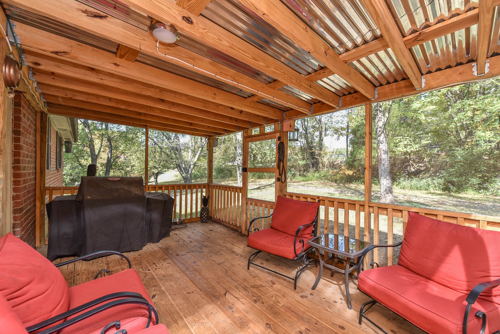 4601 Kinneys Road Springfield, TN 37172 - Photo 30 of 30 a balcony with wooden furniture and outdoor seating