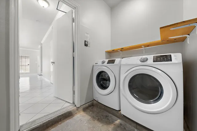 a utility room with dryer and washer