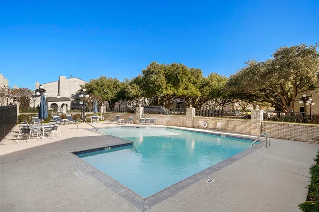 a view of swimming pool with outdoor seating and a terrace view