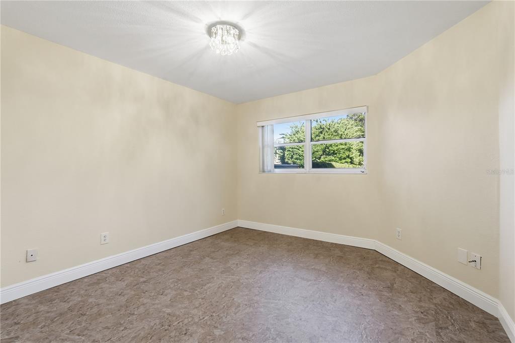 106 Hunter Court Palm Harbor, FL 34684 - Photo 13 of 21 an empty room with a window