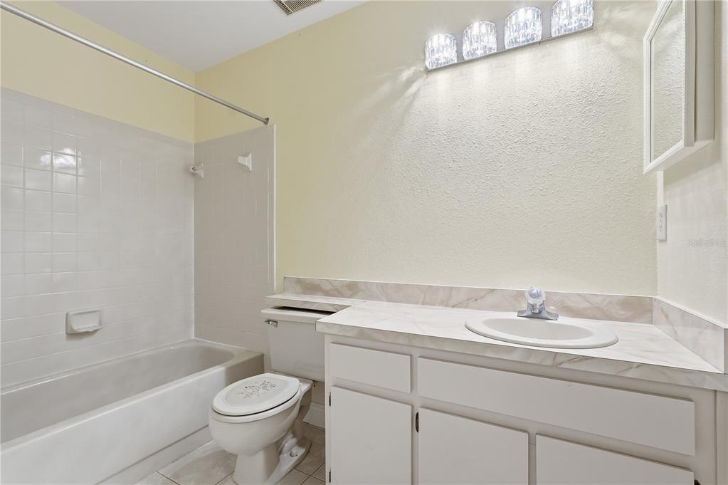 106 Hunter Court Palm Harbor, FL 34684 - Photo 14 of 21 a bathroom with a sink a toilet and shower