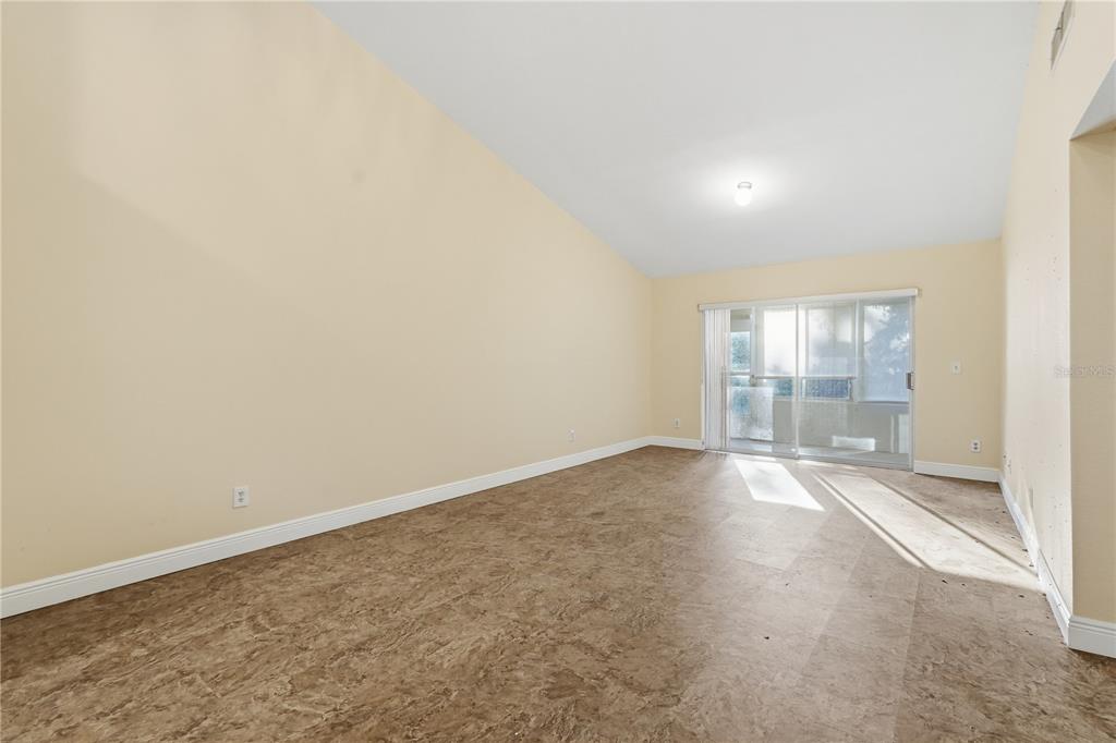 106 Hunter Court Palm Harbor, FL 34684 - Photo 3 of 21 an empty room with windows