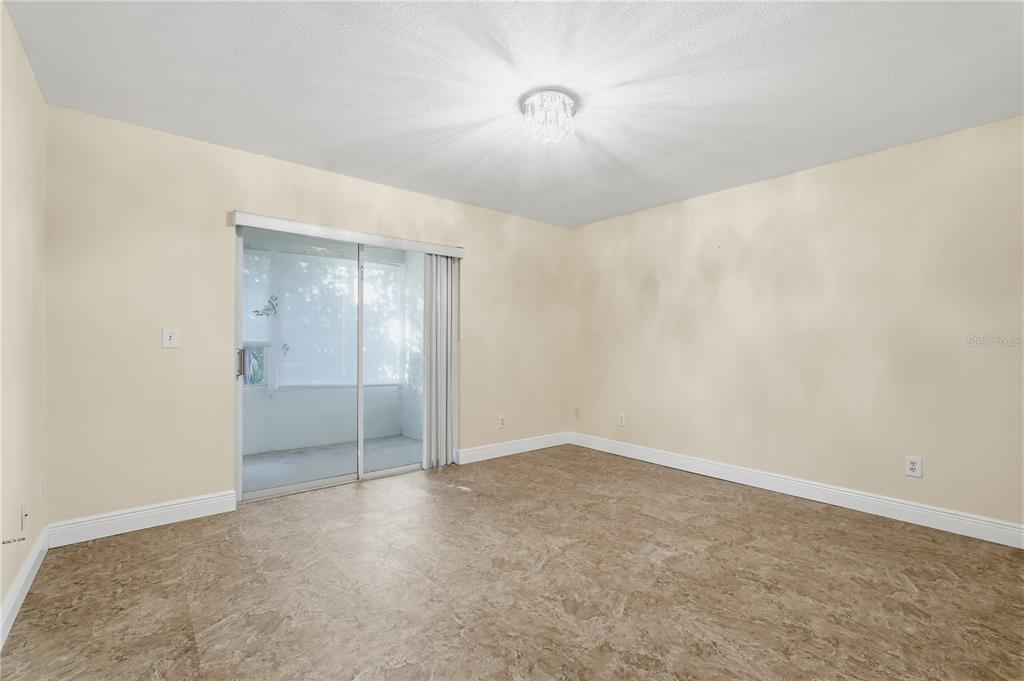 106 Hunter Court Palm Harbor, FL 34684 - Photo 9 of 21 an empty room with a empty space and windows