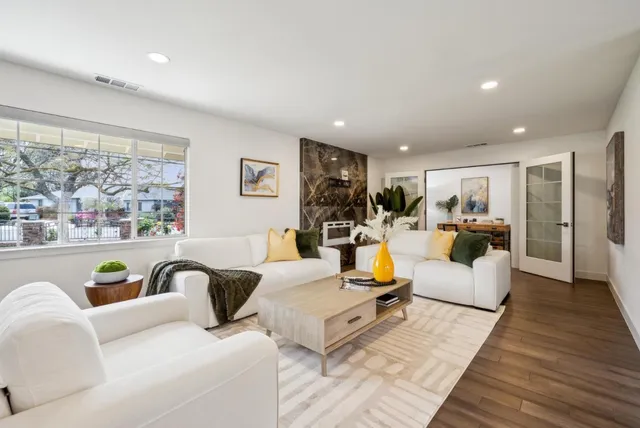 a living room with furniture and a large window