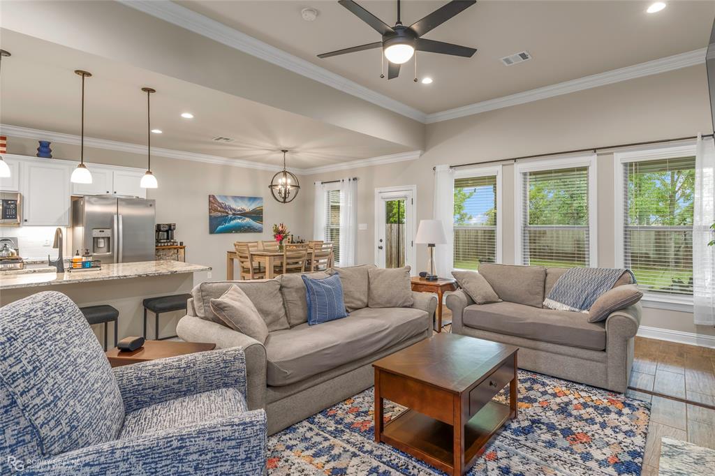 122 Brimestone Loop Benton, LA 71006 - Photo 10 of 33 a living room with furniture and a large window
