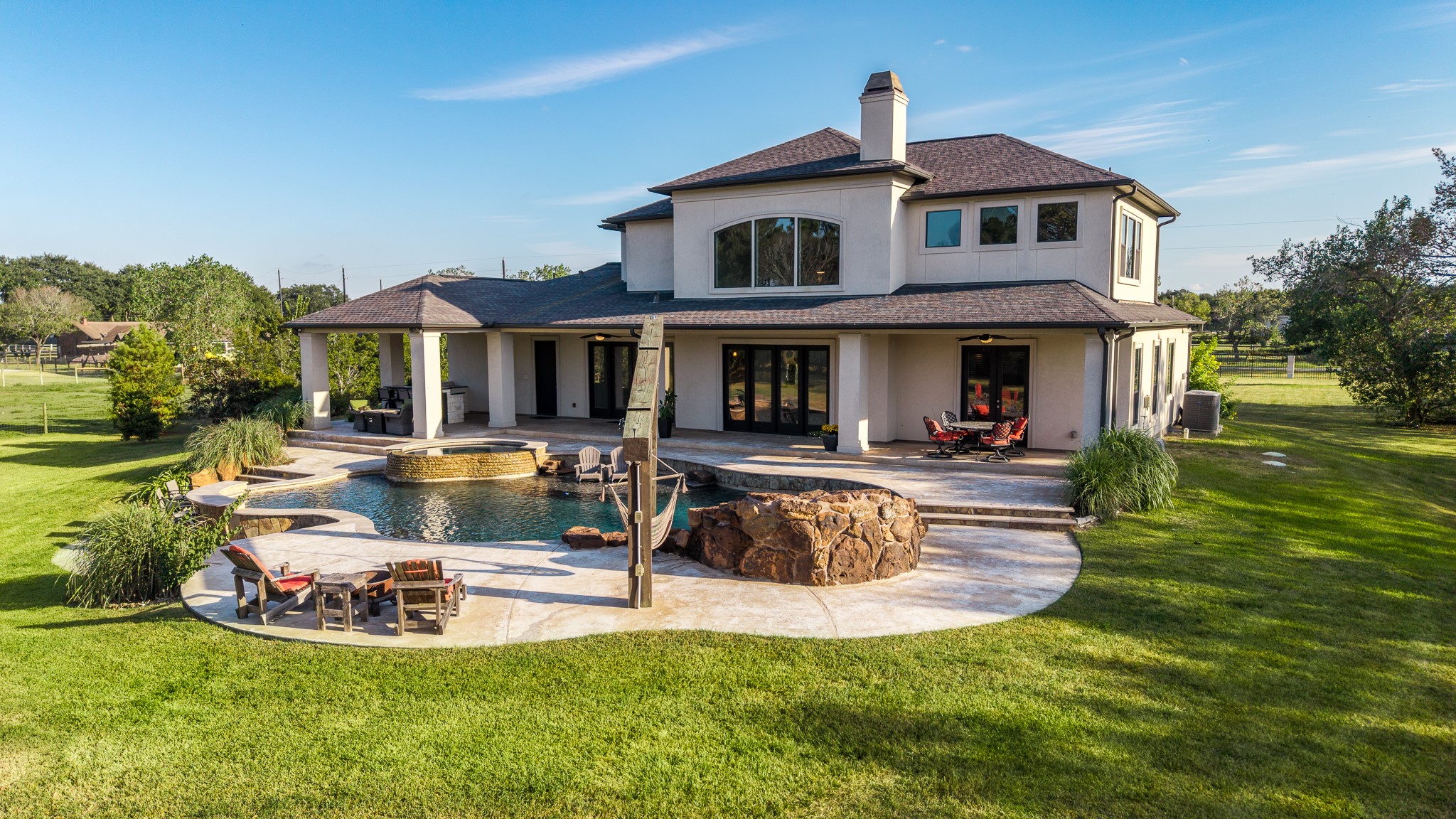 There is extensive covered patio space and a summer kitchen area for watching the fun from under cover.