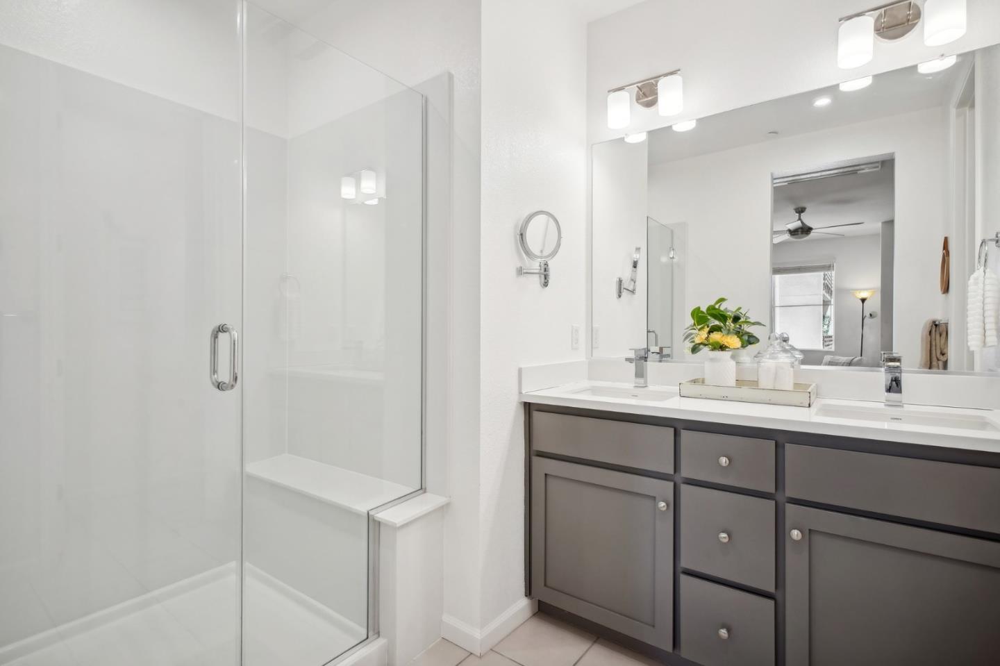 5461 Dublin Boulevard Dublin, CA 94568 - Photo 18 of 55 a bathroom with a double vanity sink and mirror