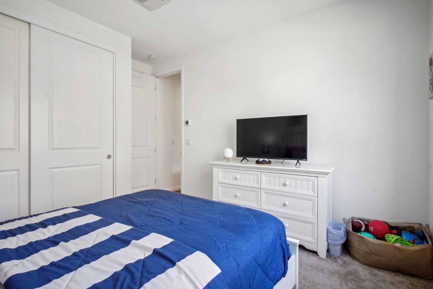 5461 Dublin Boulevard Dublin, CA 94568 - Photo 21 of 55 a bedroom with a bed and a flat screen tv