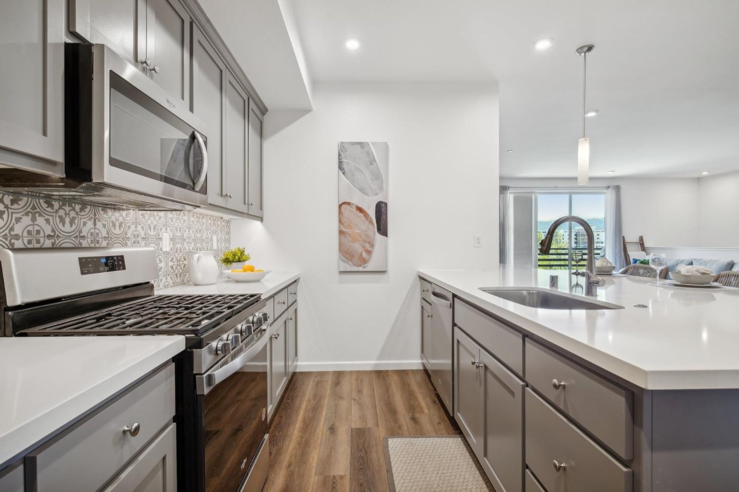 5461 Dublin Boulevard Dublin, CA 94568 - Photo 10 of 55 a kitchen with stainless steel appliances a sink stove and cabinets