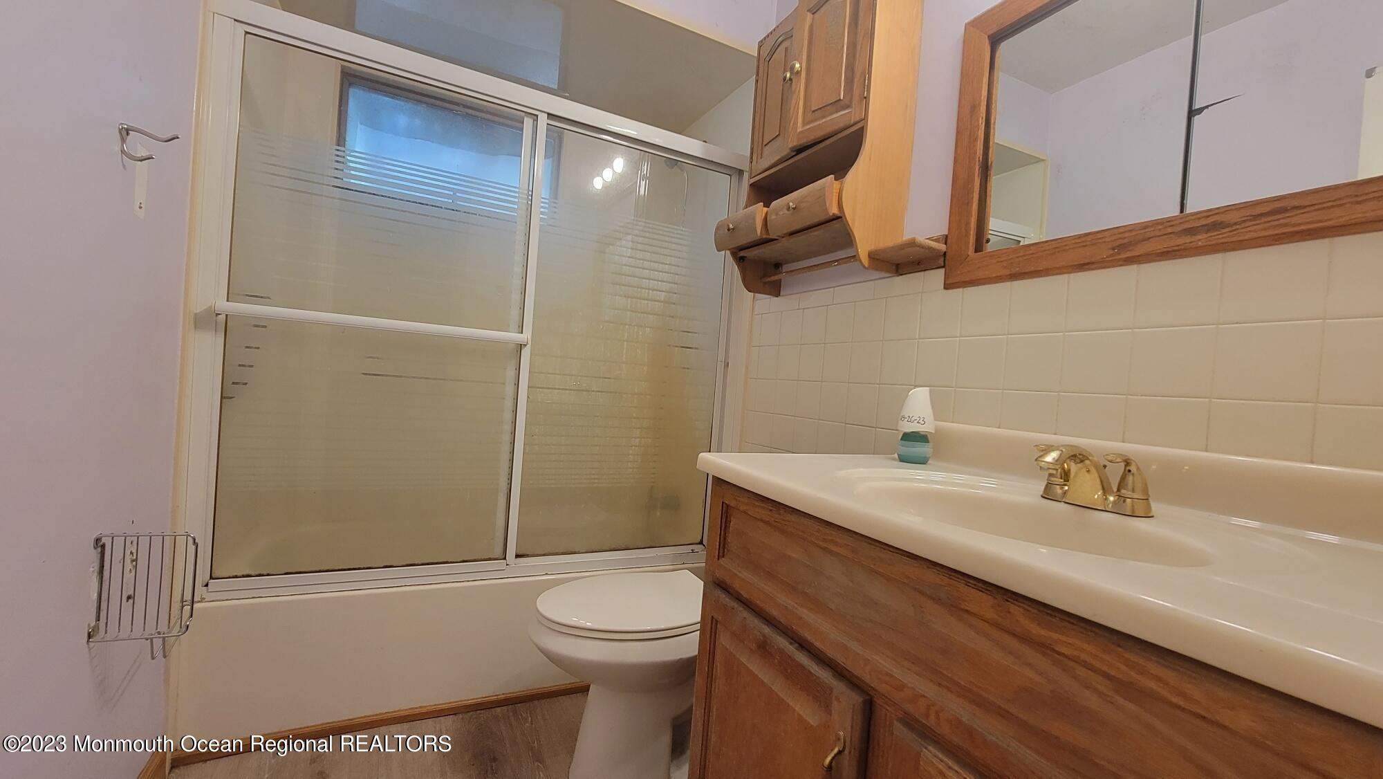 77 Smith Street Howell, NJ 07731 - Photo 12 of 15 a bathroom with a sink a toilet and shower
