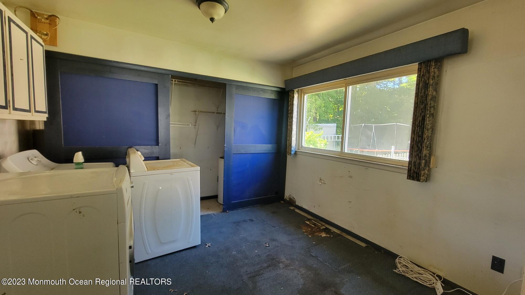 77 Smith Street Howell, NJ 07731 - Photo 14 of 15 a view of storage and utility room with washer and dryer