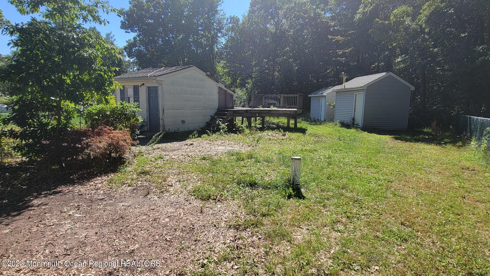 77 Smith Street Howell, NJ 07731 - Photo 15 of 15 a backyard of a house with a yard and outdoor seating
