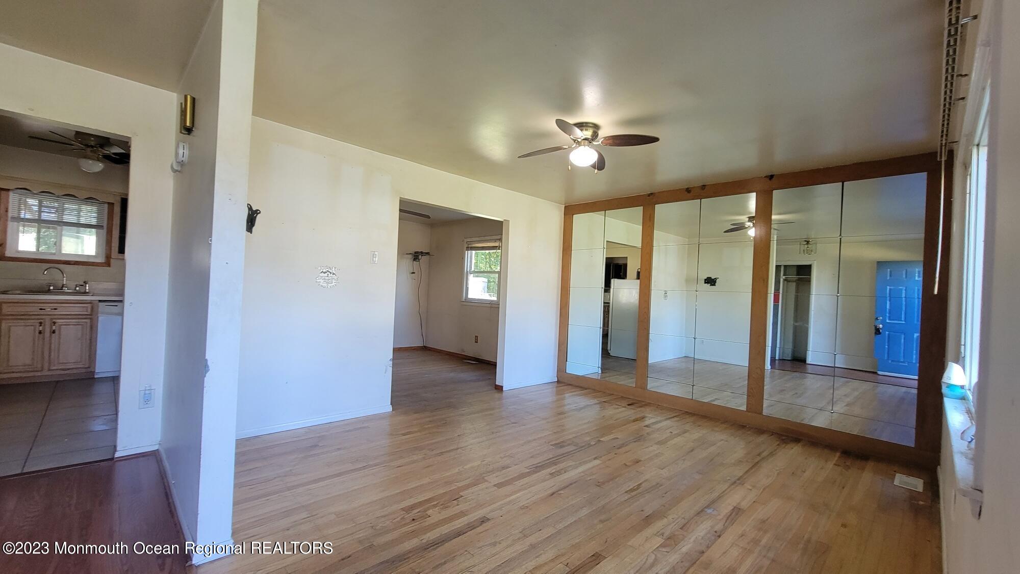 77 Smith Street Howell, NJ 07731 - Photo 3 of 15 a view of a hallway with wooden floor