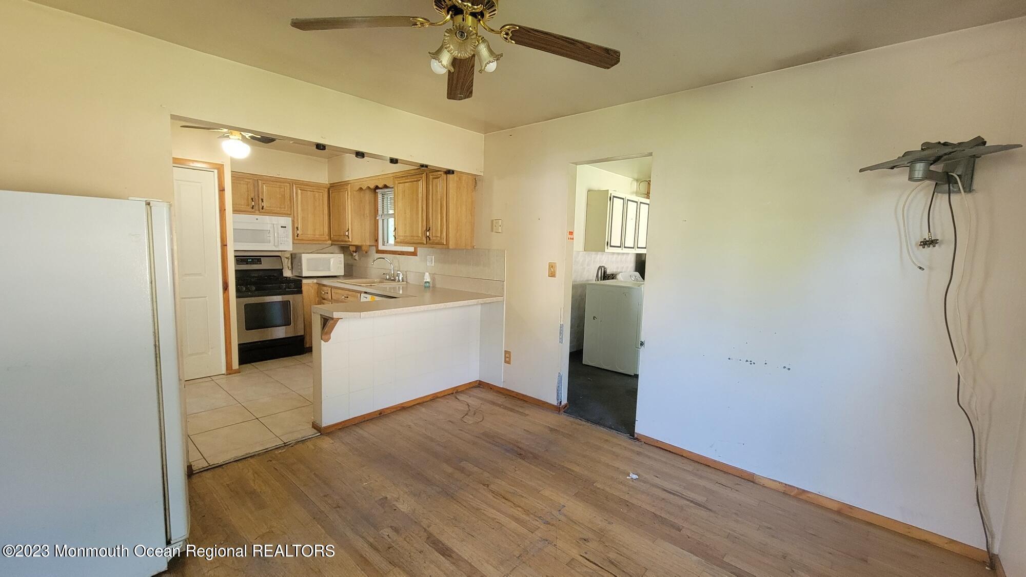77 Smith Street Howell, NJ 07731 - Photo 6 of 15 a view of a kitchen with a sink and refrigerator