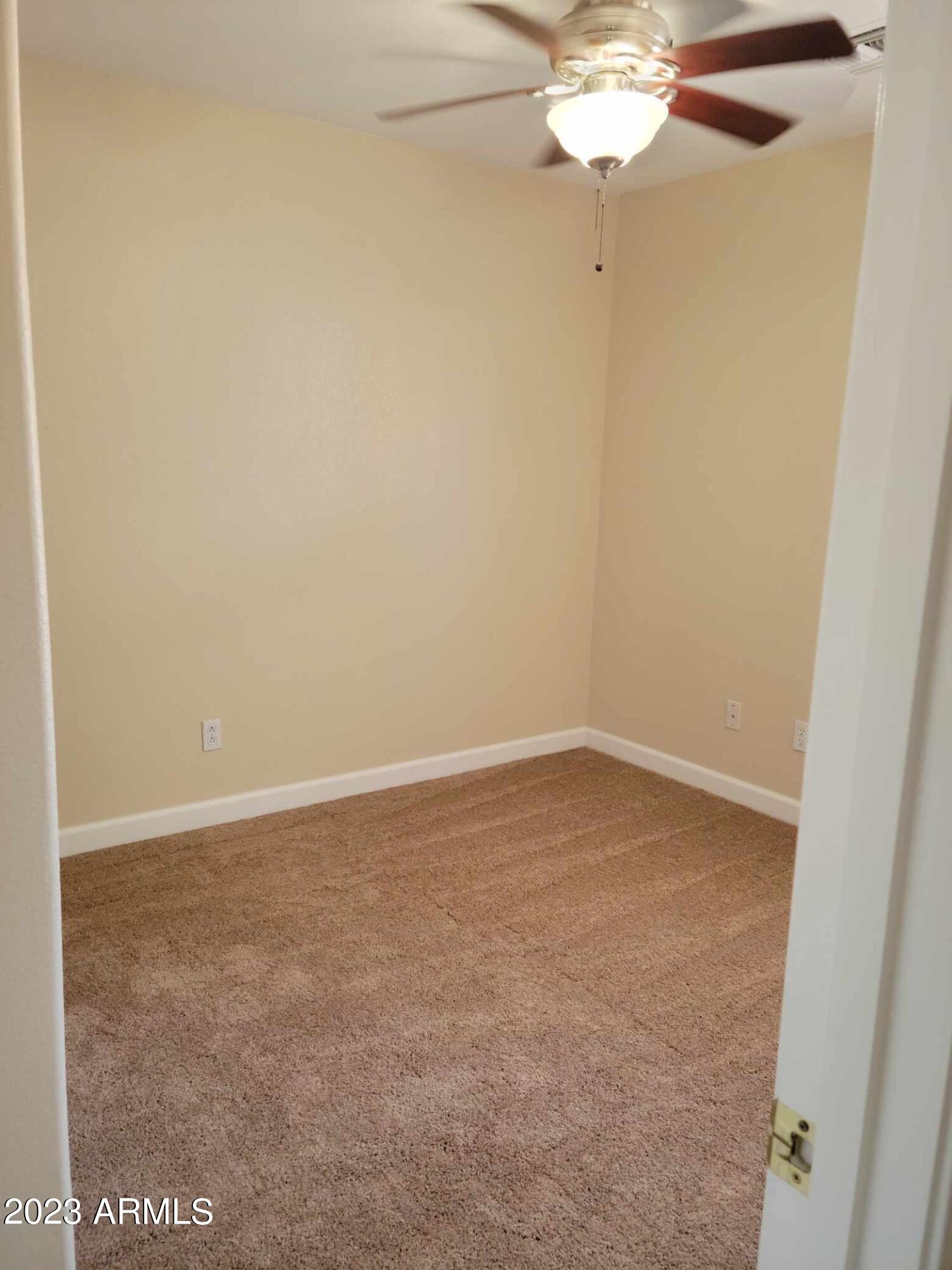 13555 West Watson Lane Surprise, AZ 85379 - Photo 11 of 21 a view of a room with a fan and a fan