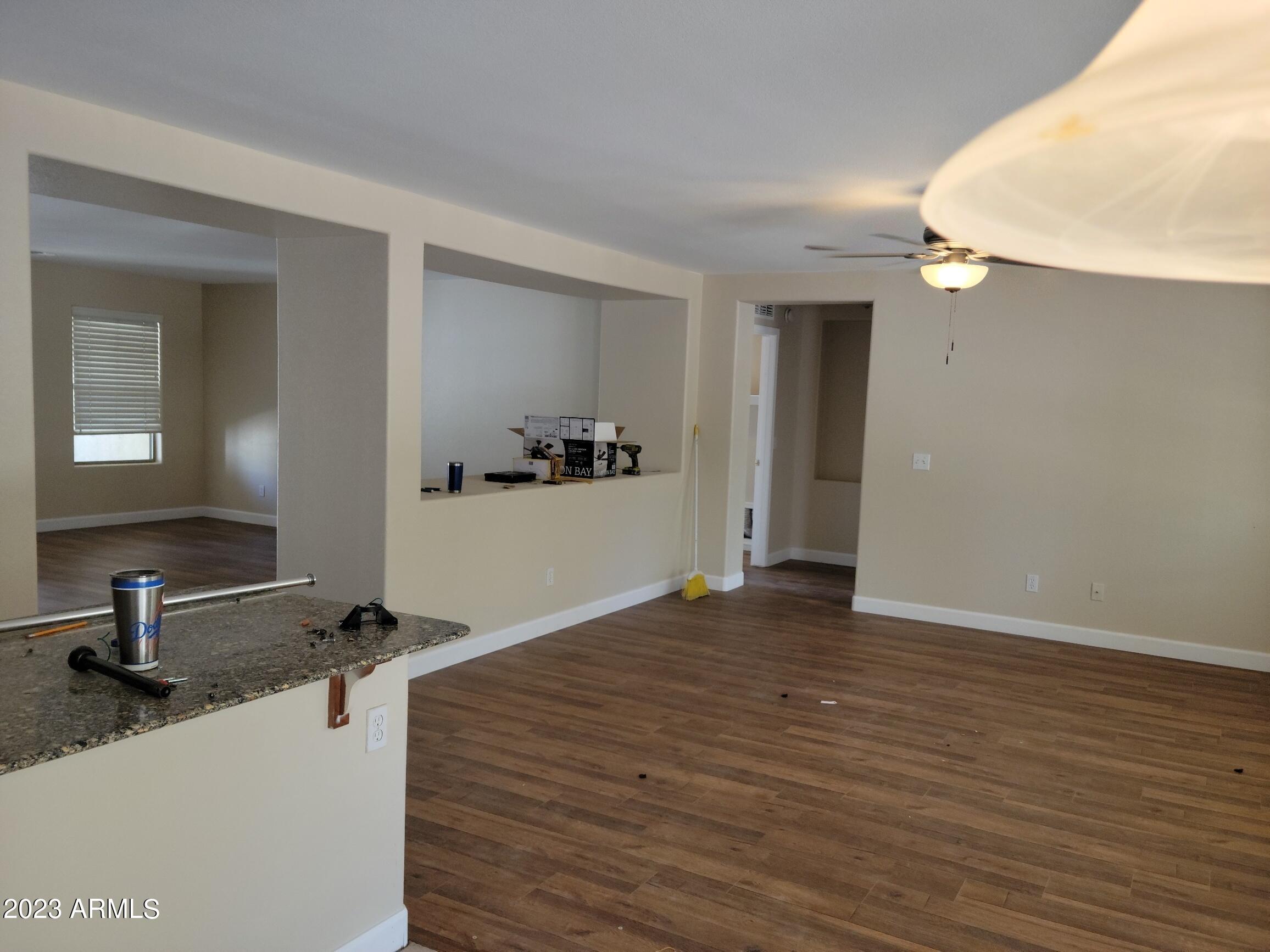 13555 West Watson Lane Surprise, AZ 85379 - Photo 19 of 21 a view of a kitchen with a sink and cabinets