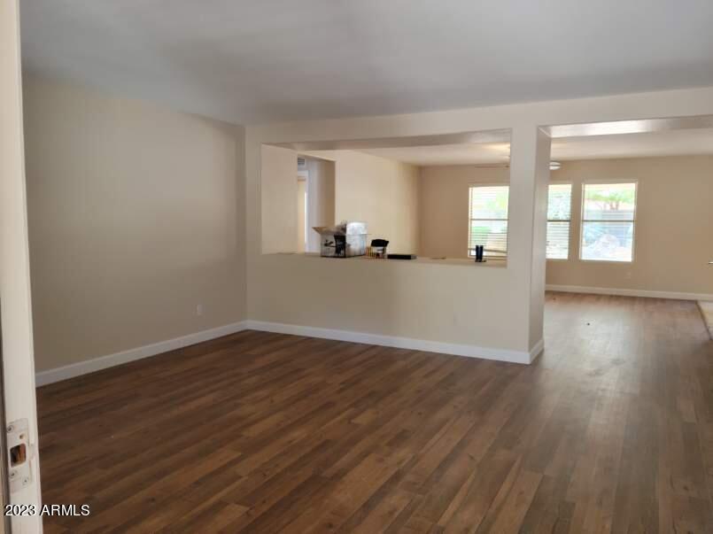 13555 West Watson Lane Surprise, AZ 85379 - Photo 20 of 21 wooden floor in an empty room with a window