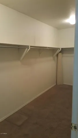 a view of an empty walk in closet