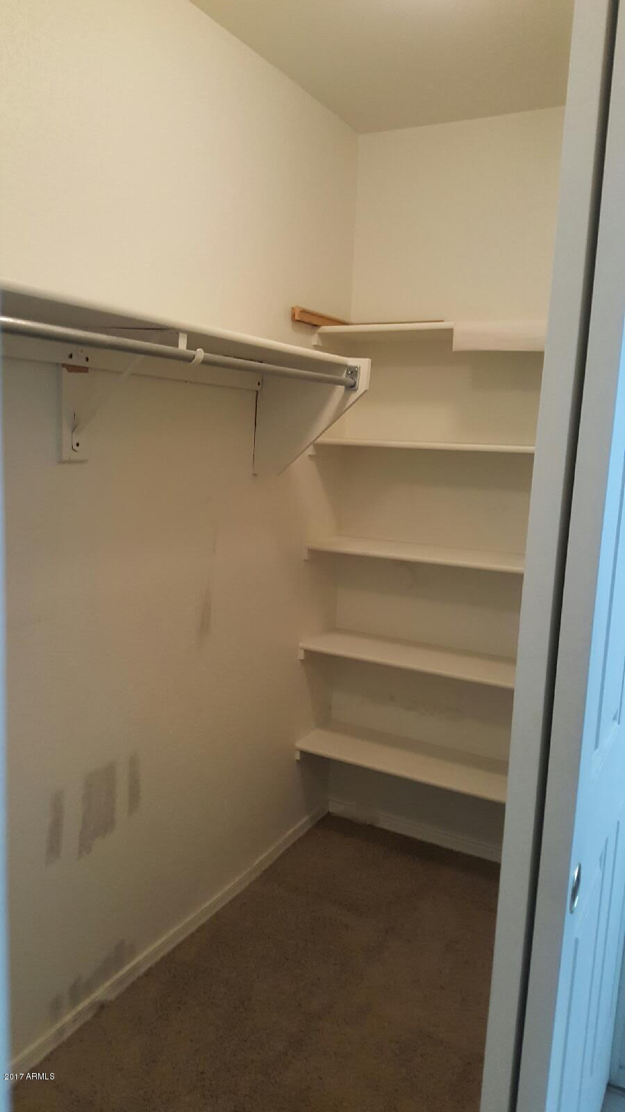 13555 West Watson Lane Surprise, AZ 85379 - Photo 7 of 21 a view of an empty walk in closet