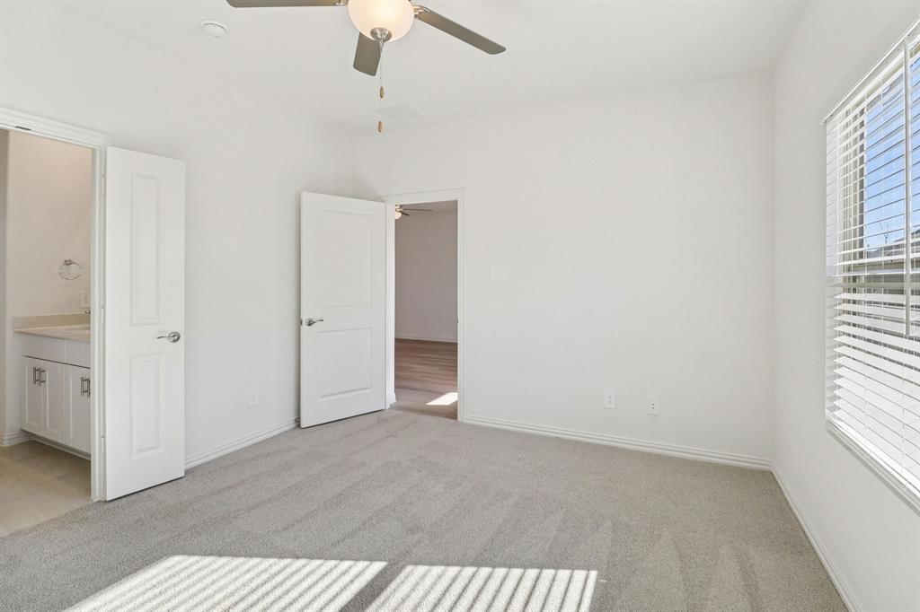 1708 Arches Road Anna, TX 75409 - Photo 17 of 21 wooden floor in an empty room with a window