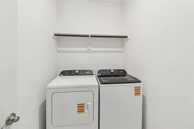 a utility room with dryer and washer