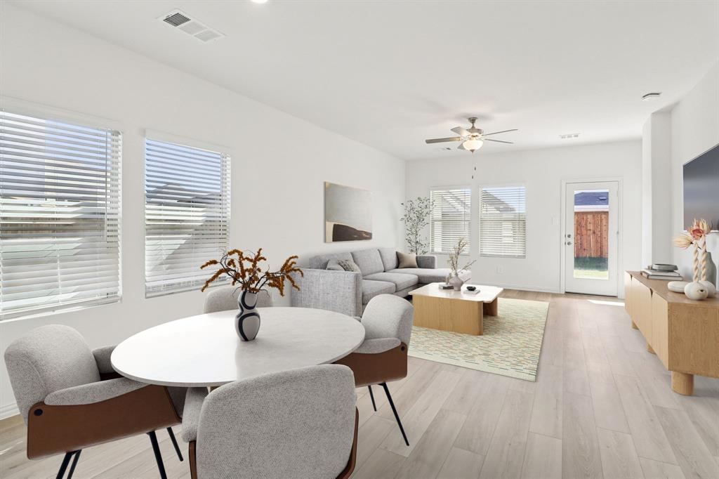 1708 Arches Road Anna, TX 75409 - Photo 6 of 21 a living room with furniture a dining table and a chandelier