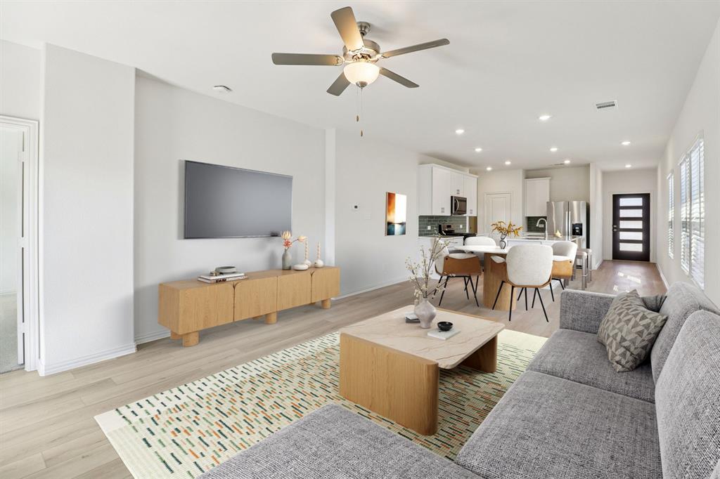 1708 Arches Road Anna, TX 75409 - Photo 8 of 21 a living room with furniture and a flat screen tv