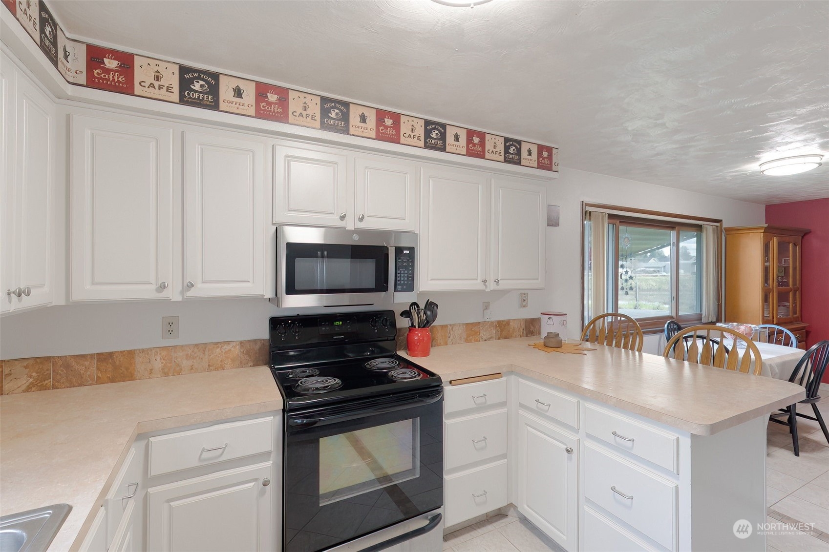 10 Lee Place Longview, WA 98632 - Photo 11 of 38 a kitchen with stainless steel appliances granite countertop a sink stove and cabinets