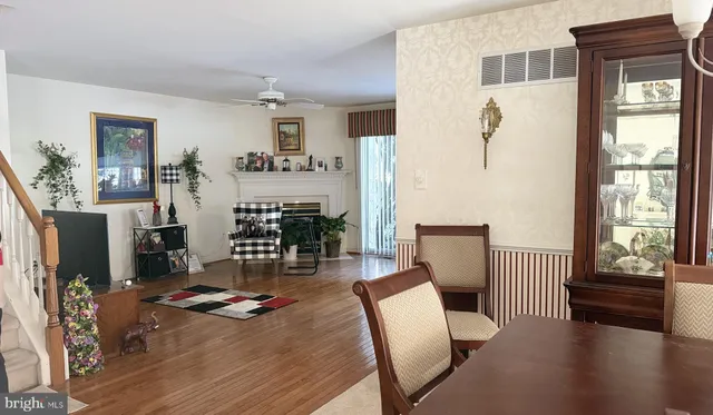 a living room with furniture a fireplace and a table