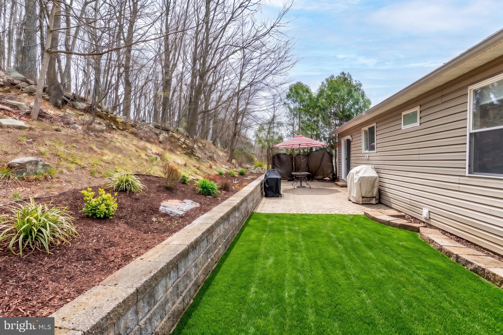 54 Highview Terrace Dover, NJ 07801 - Photo 28 of 32 Serene backyard oasis with lush greenery.