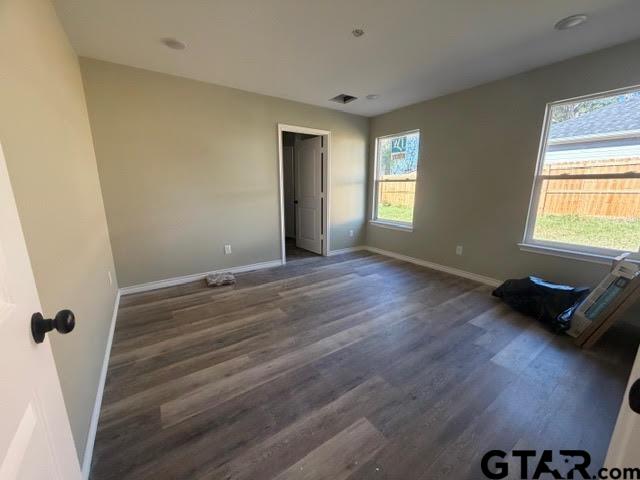 623 North Weldon Street Frankston, TX 75763 - Photo 16 of 29 a view of an empty room with wooden floor and a window