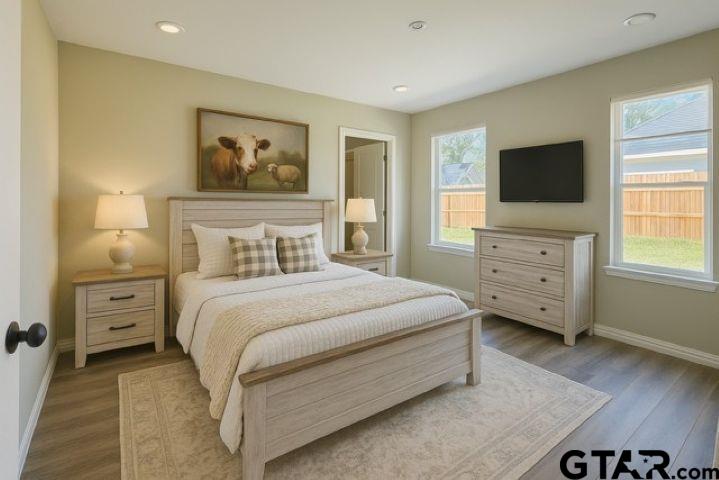 623 North Weldon Street Frankston, TX 75763 - Photo 17 of 29 a bedroom with a bed and a tv